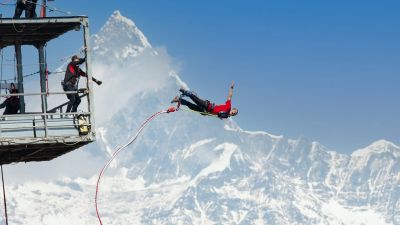 Bungee jumper diving off the cantilever bridge over the Seti Gorge in Pokhara, Nepal